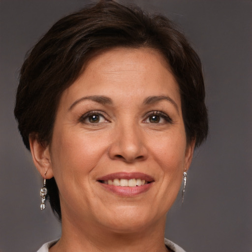 Joyful white adult female with short  brown hair and brown eyes