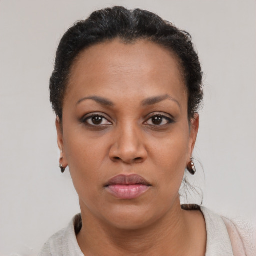 Neutral black adult female with short  black hair and brown eyes