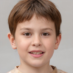 Joyful white child male with short  brown hair and brown eyes