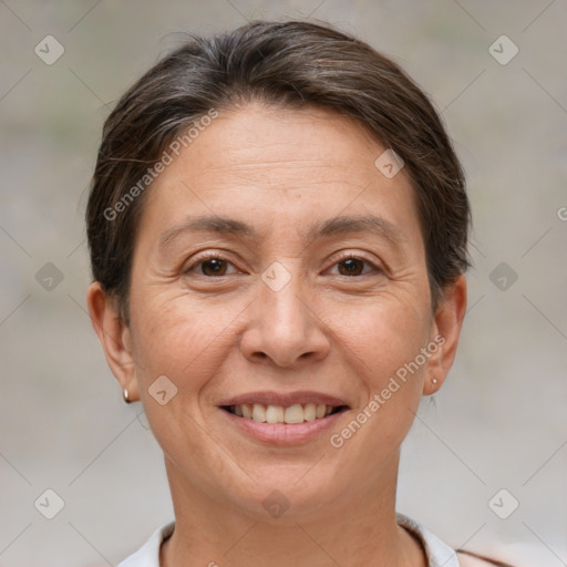 Joyful white adult female with short  brown hair and brown eyes