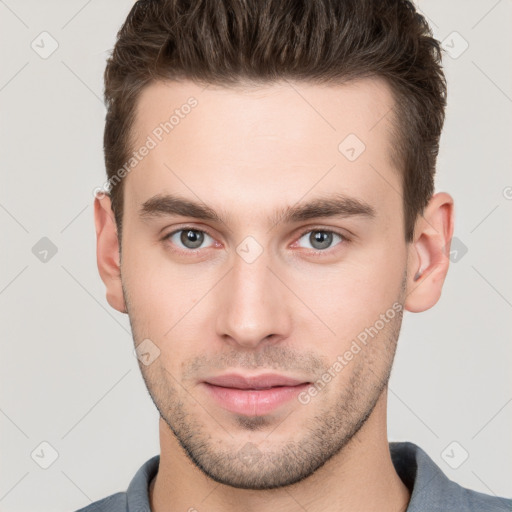 Neutral white young-adult male with short  brown hair and brown eyes