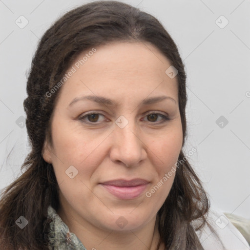 Joyful white adult female with long  brown hair and brown eyes