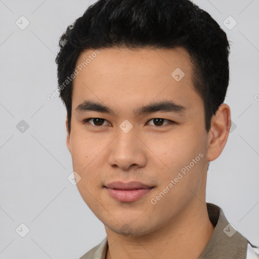 Joyful asian young-adult male with short  black hair and brown eyes