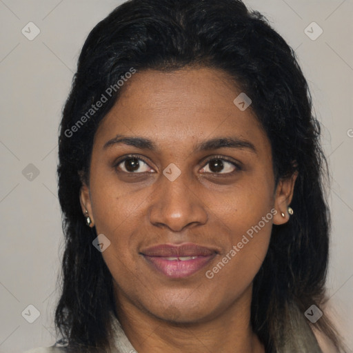 Joyful black adult female with medium  brown hair and brown eyes