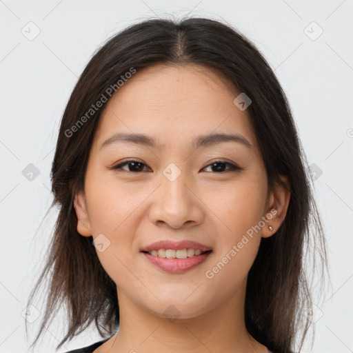 Joyful asian young-adult female with medium  brown hair and brown eyes