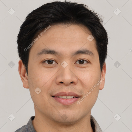 Joyful asian young-adult male with short  brown hair and brown eyes