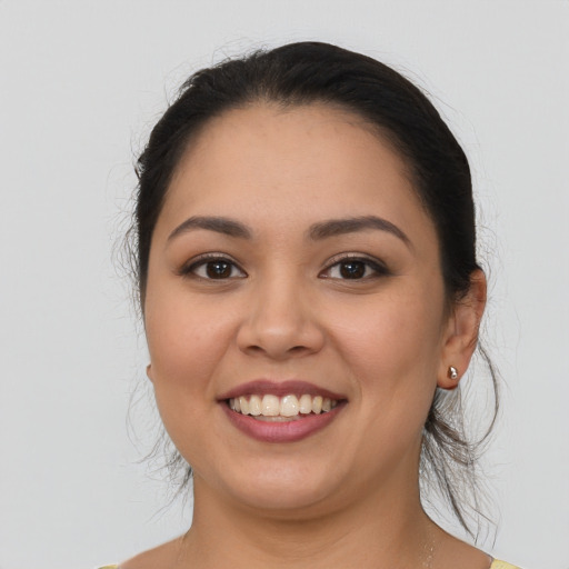 Joyful asian young-adult female with medium  brown hair and brown eyes