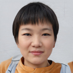 Joyful white child female with short  brown hair and brown eyes