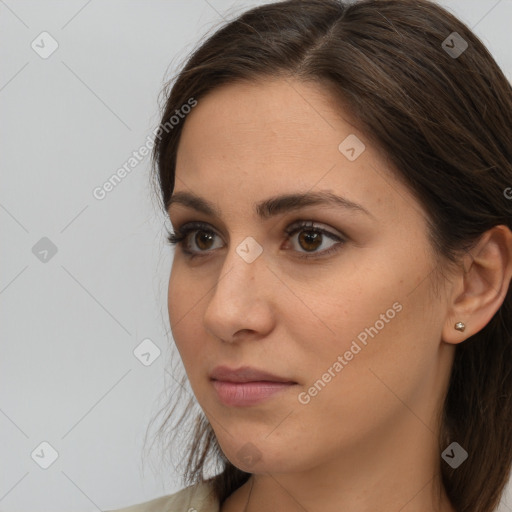 Neutral white young-adult female with long  brown hair and brown eyes