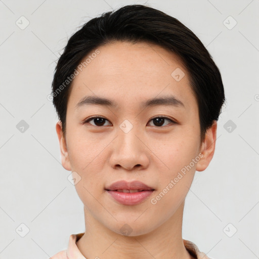 Joyful asian young-adult female with short  black hair and brown eyes