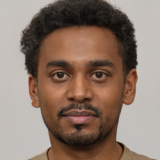Neutral black young-adult male with short  black hair and brown eyes