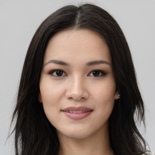 Joyful asian young-adult female with long  brown hair and brown eyes