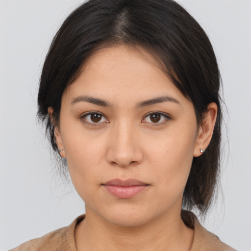 Joyful asian young-adult female with medium  brown hair and brown eyes