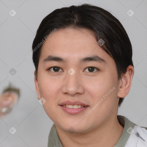 Joyful asian young-adult male with medium  brown hair and brown eyes