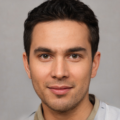 Joyful white young-adult male with short  brown hair and brown eyes