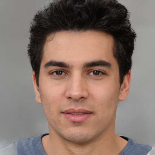 Neutral white young-adult male with short  black hair and brown eyes