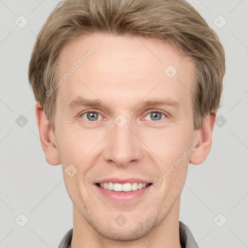 Joyful white adult male with short  brown hair and grey eyes