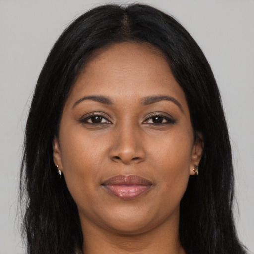 Joyful asian young-adult female with long  brown hair and brown eyes
