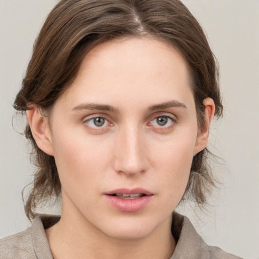 Neutral white young-adult female with medium  brown hair and grey eyes