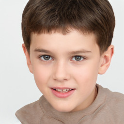 Joyful white child male with short  brown hair and brown eyes