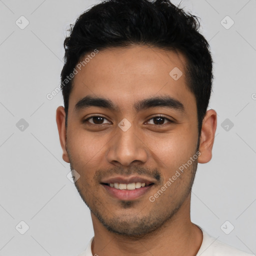 Joyful latino young-adult male with short  black hair and brown eyes