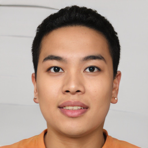 Joyful asian young-adult male with short  black hair and brown eyes