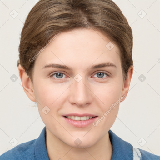 Joyful white young-adult female with short  brown hair and grey eyes