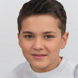 Joyful white child male with short  brown hair and brown eyes