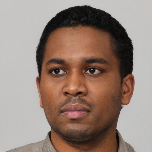 Neutral black young-adult male with short  black hair and brown eyes