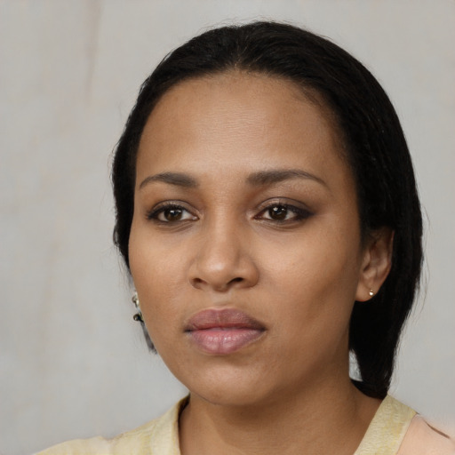 Neutral black young-adult female with medium  black hair and brown eyes