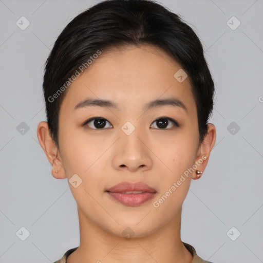 Joyful asian young-adult female with short  black hair and brown eyes