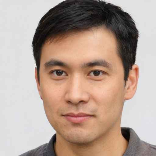 Neutral asian young-adult male with short  black hair and brown eyes