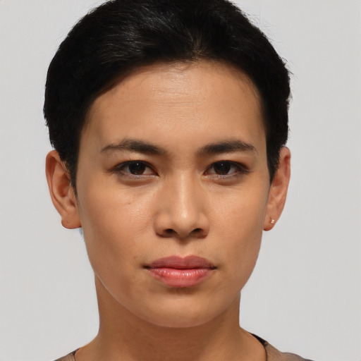 Joyful asian young-adult female with short  black hair and brown eyes