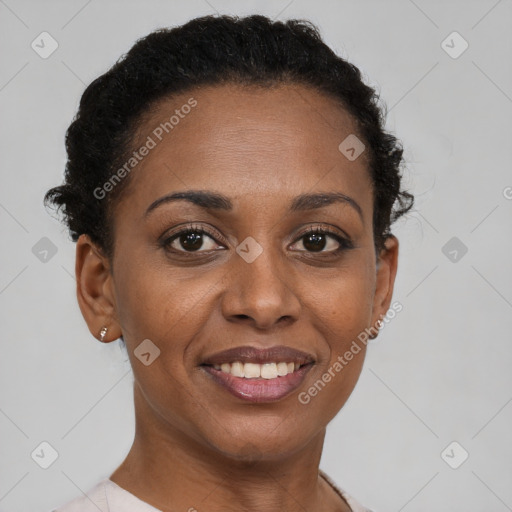 Joyful black young-adult female with short  brown hair and brown eyes