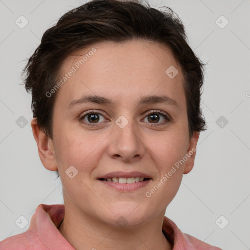 Joyful white young-adult female with short  brown hair and grey eyes