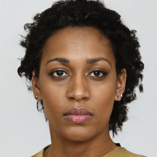 Neutral black young-adult female with short  black hair and brown eyes