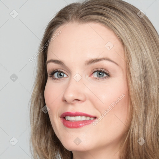 Joyful white young-adult female with long  brown hair and blue eyes