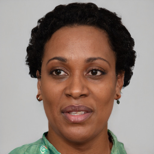 Joyful latino adult female with short  black hair and brown eyes