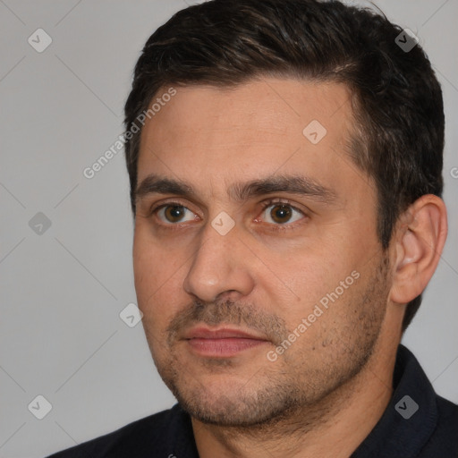 Joyful white adult male with short  brown hair and brown eyes