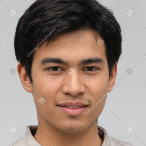 Joyful asian young-adult male with short  black hair and brown eyes