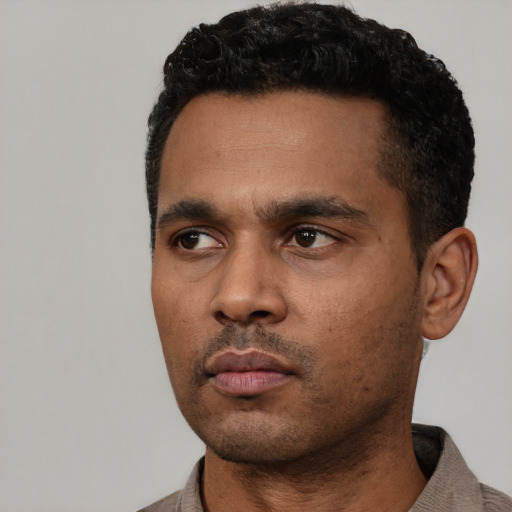 Neutral black young-adult male with short  black hair and brown eyes
