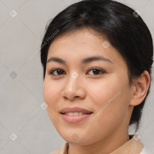 Joyful asian young-adult female with medium  brown hair and brown eyes