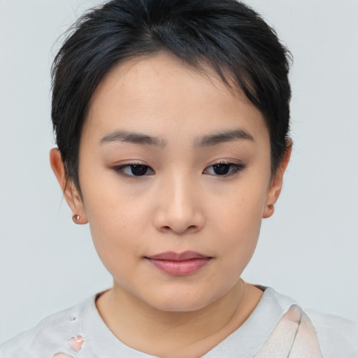 Joyful asian young-adult female with short  brown hair and brown eyes