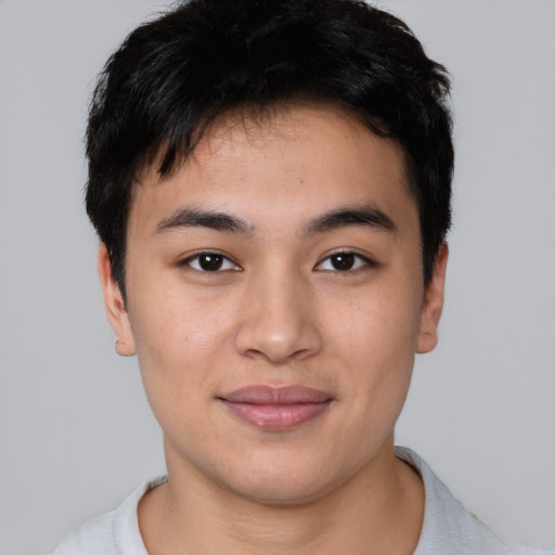 Joyful asian young-adult male with short  brown hair and brown eyes