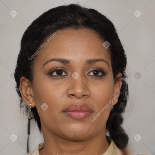Joyful black adult female with medium  brown hair and brown eyes