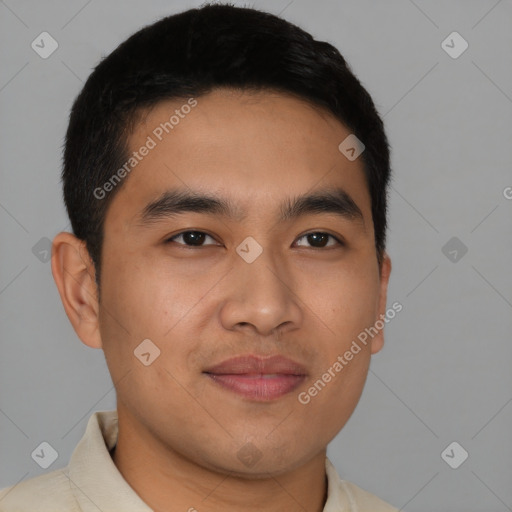 Joyful latino young-adult male with short  brown hair and brown eyes