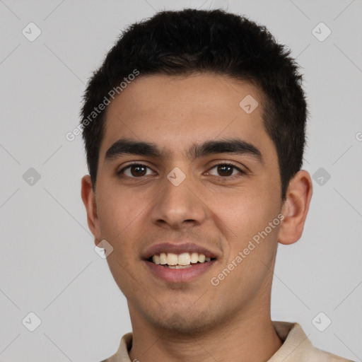 Joyful white young-adult male with short  black hair and brown eyes