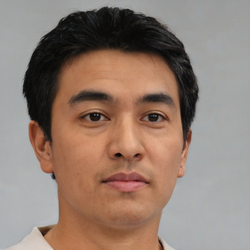 Neutral asian young-adult male with short  brown hair and brown eyes