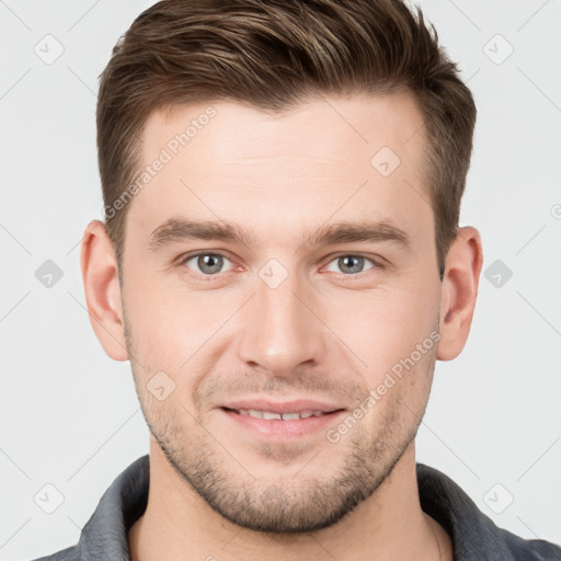 Joyful white young-adult male with short  brown hair and grey eyes