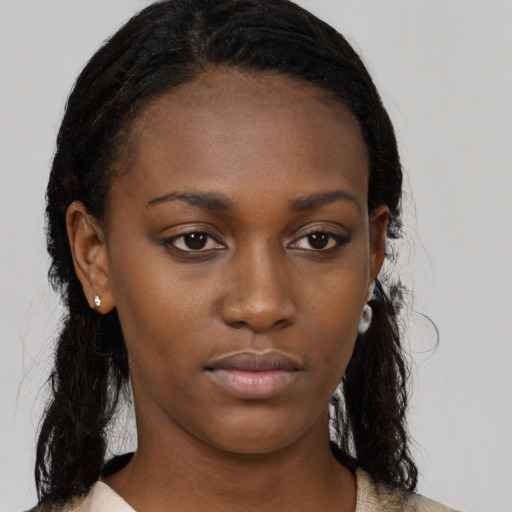 Neutral black young-adult female with long  black hair and brown eyes
